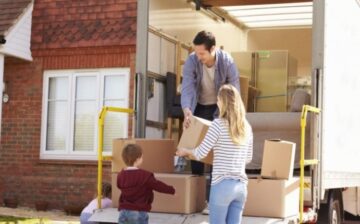 a man and a women loading moving boxes