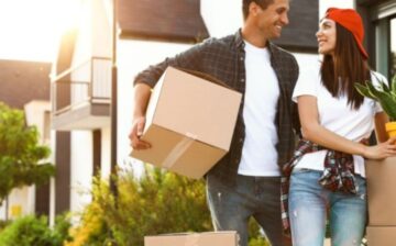 couple moving packed moving boxes to storage