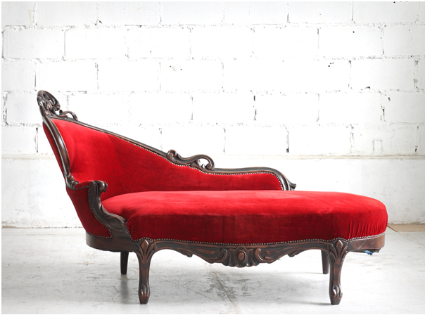 red-upholstered lounge chair