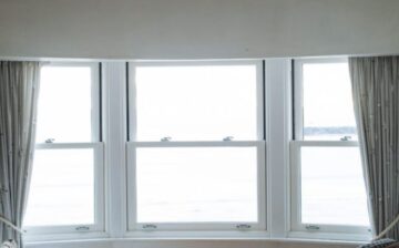 sitting room with chairs facing windows