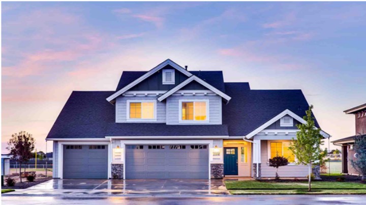 front of a house at dusk