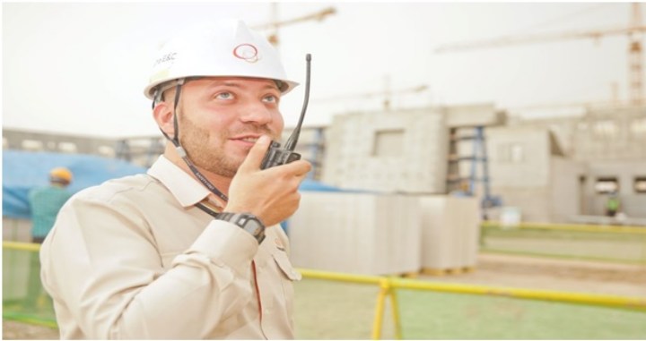 worker talking on radio