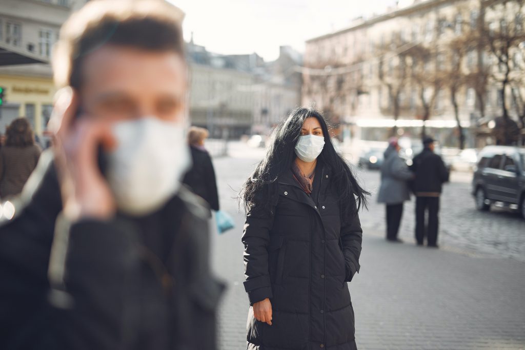 people on street wearing facemasks