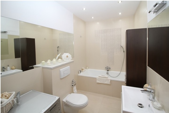 lavender-themed bathroom with large mirror