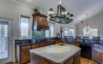 elegant kitchen with wood cabinets and floor