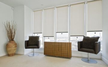 recreation room with roller blinds over the windows