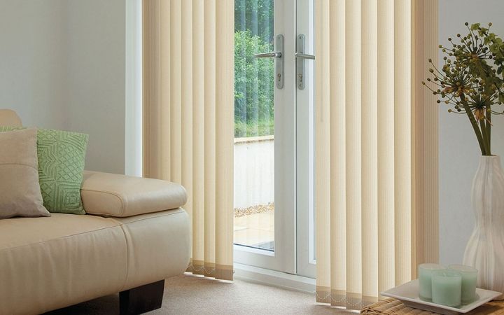 vertical blinds covering a glass back door