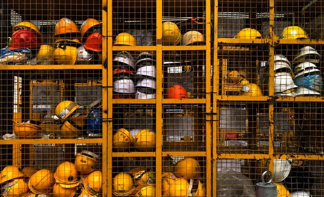 construction helmets stored on shelves in a locker