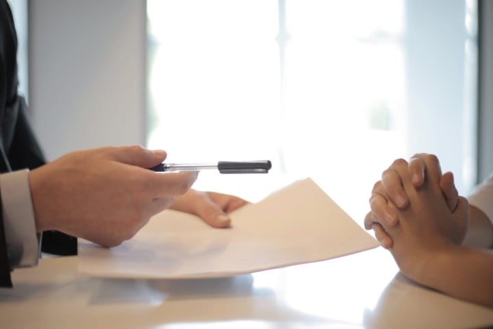 hands for signing a paper