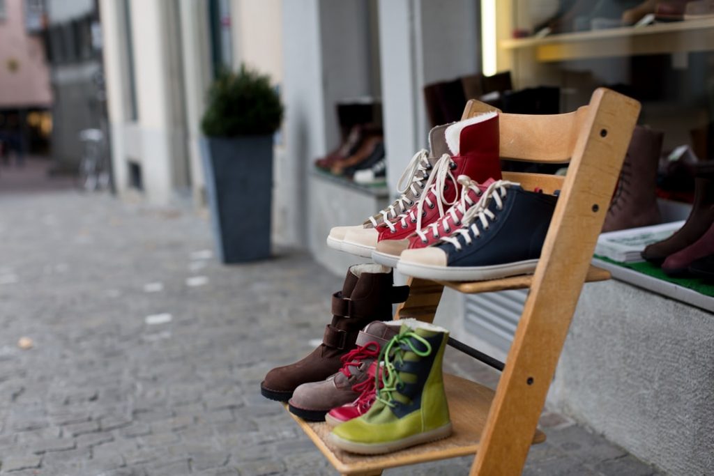 collection of shoes along a street