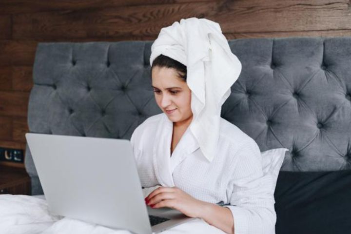 woman with computer in bed