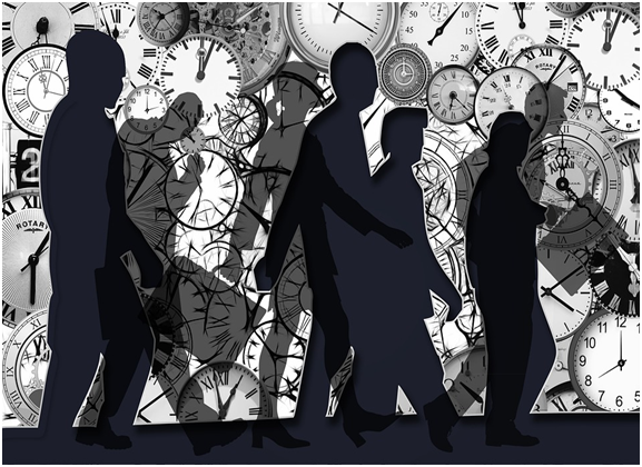 silhouettes of people walking with clocks in background