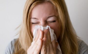 woman sneezing