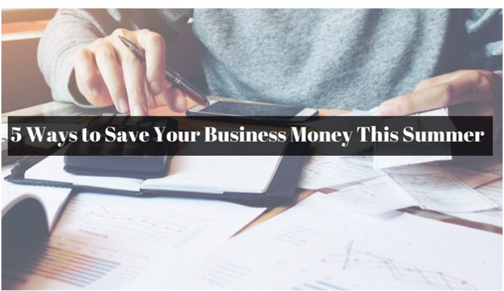 business person at a desk with calculator and papers