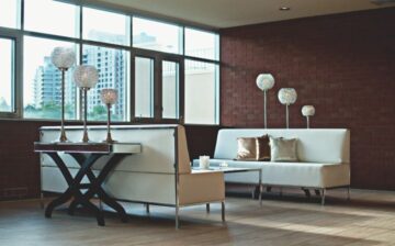 Dining room decorated with armchairs and lamps