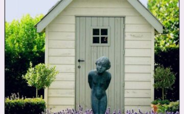 garden shed with statue in front