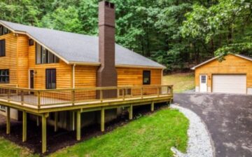 house with wood siding by a forest