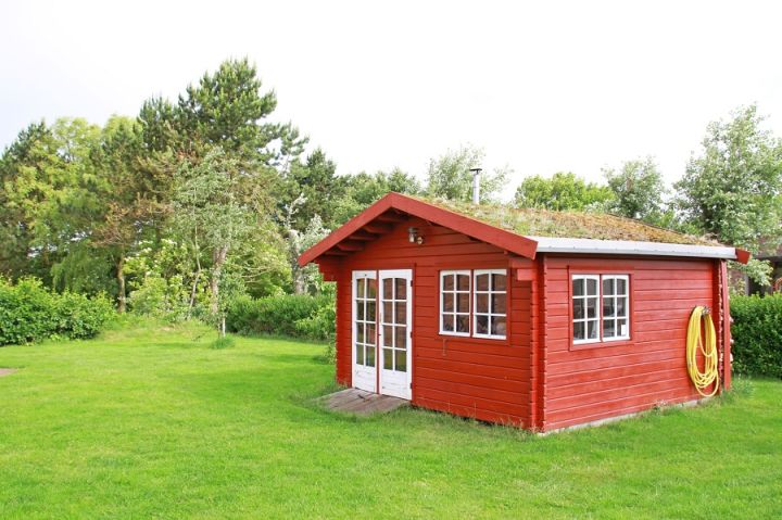 barn-like garden shed with red wood siding
