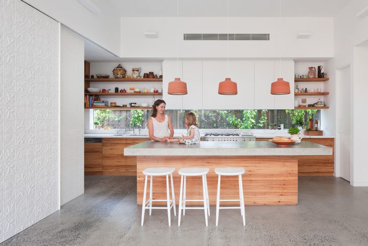 mother and child in kitchen with grind and seal floor