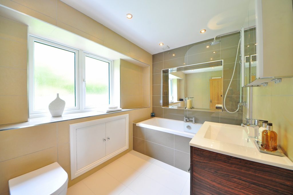 bathroom with window and pink walls