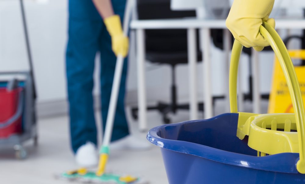 cleaners mopping a floor
