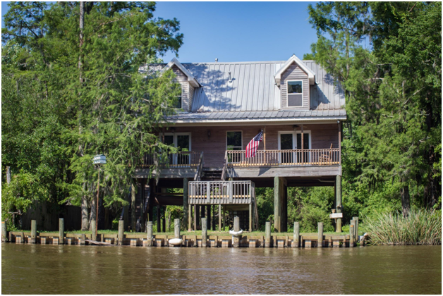 stilt house by a body of water