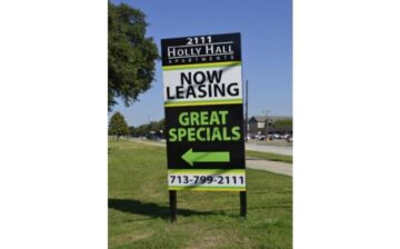 now leasing sign nailed to the grass