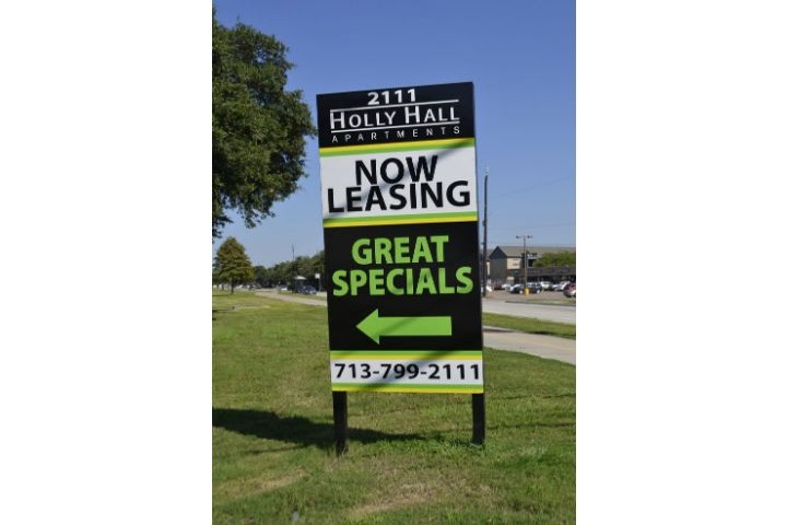 now leasing sign nailed to the grass