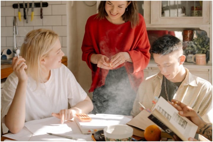 young people studying at a table