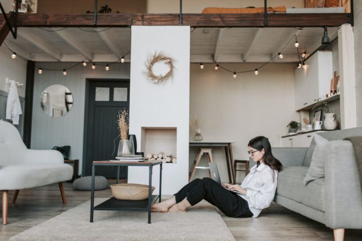 Woman Sitting in Decorative Living Room