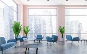 lounge area with vinyl floor and large windows