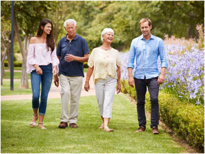 young and old couple walking together