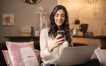 Woman with Phone and Laptop