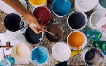 buckets of paint of different colors