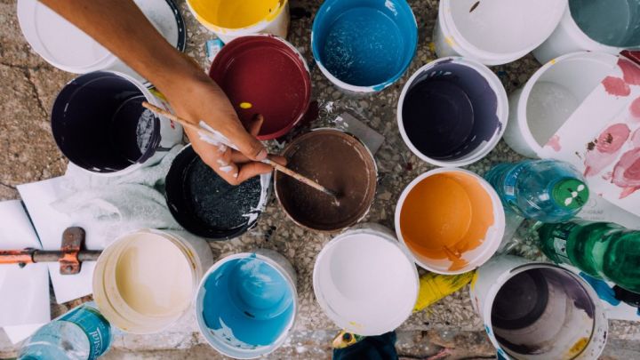 buckets of paint of different colors