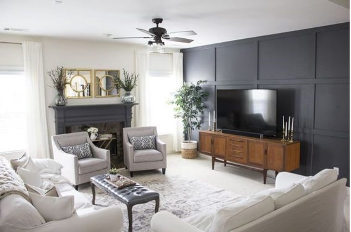 living room with white furniture and large TV