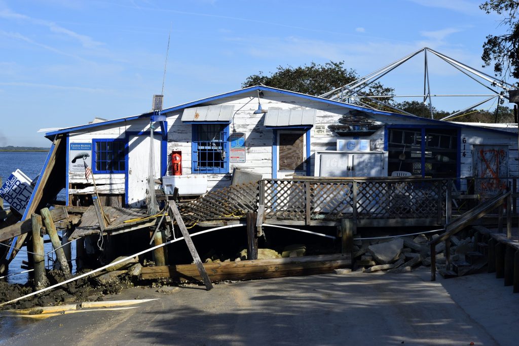 water damaged house near a body of water