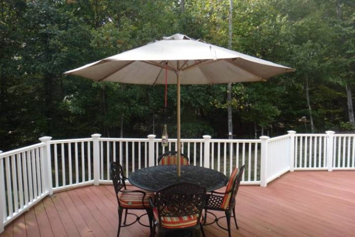 patio with table and umbrella outside