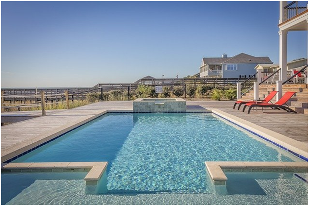 multi-story house in countryside with backyard pool