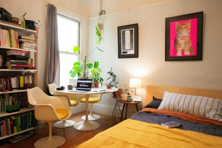 bedroom with work table and bookcase