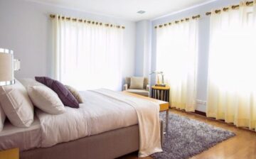bedroom with clear drapes