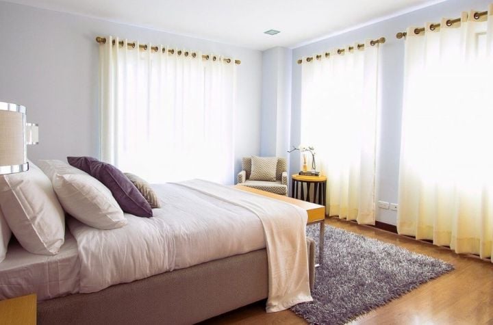 bedroom with clear drapes