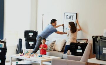 couple unpacking and arranging after a move