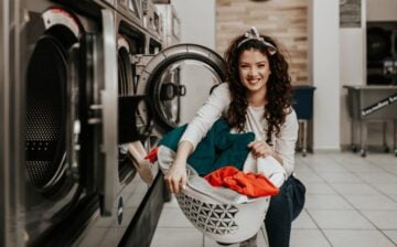 woman doing laundry in a public facility