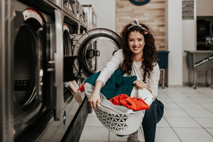 woman doing laundry in a public facility