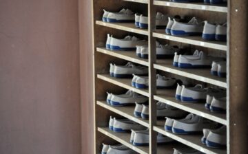 pairs of identical shoes in a cabinet
