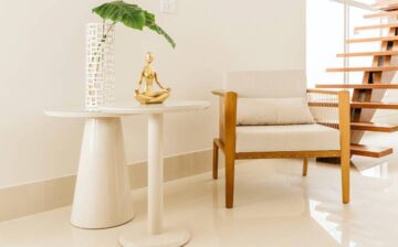 white room with table and chair with decoration