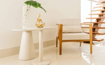 white room with table and chair with decoration