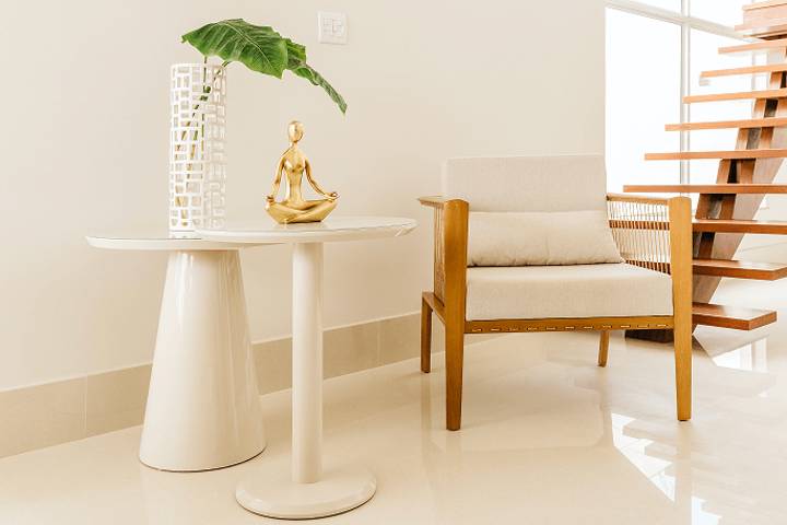 white room with table and chair with decoration