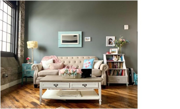 living room with pink sofa